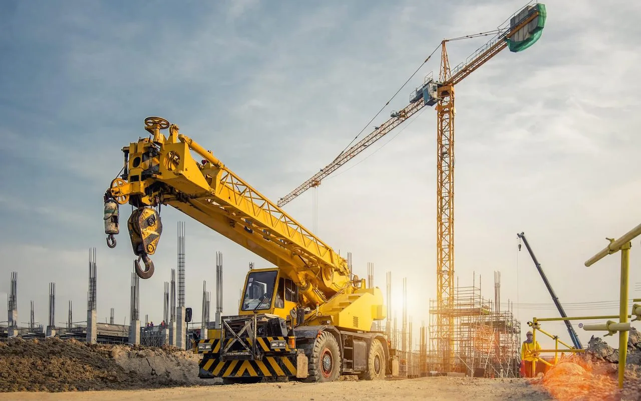 Mobile crane and tower crane on a construction site